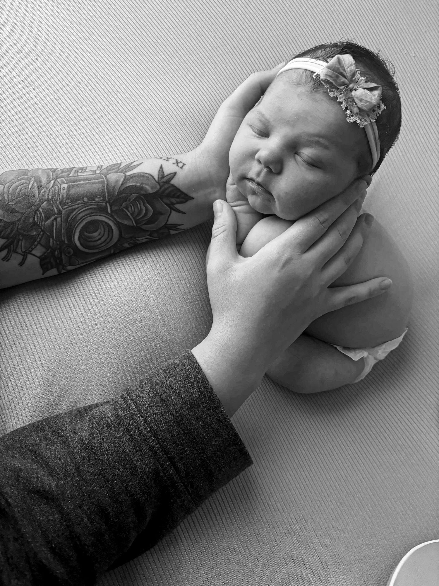 A black and white photo of a sleeping newborn. Southeast Michigan Newborn Photographer located in Highland MI