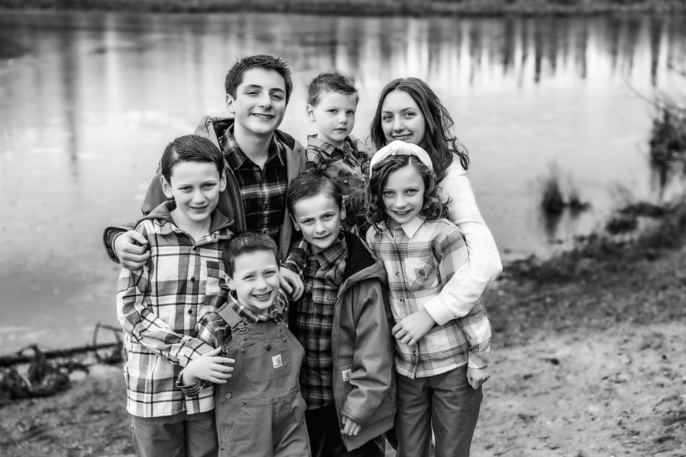Candid moment of a family happy together during a relaxed generational portrait session, Fairbanks Alaska portrait photographer