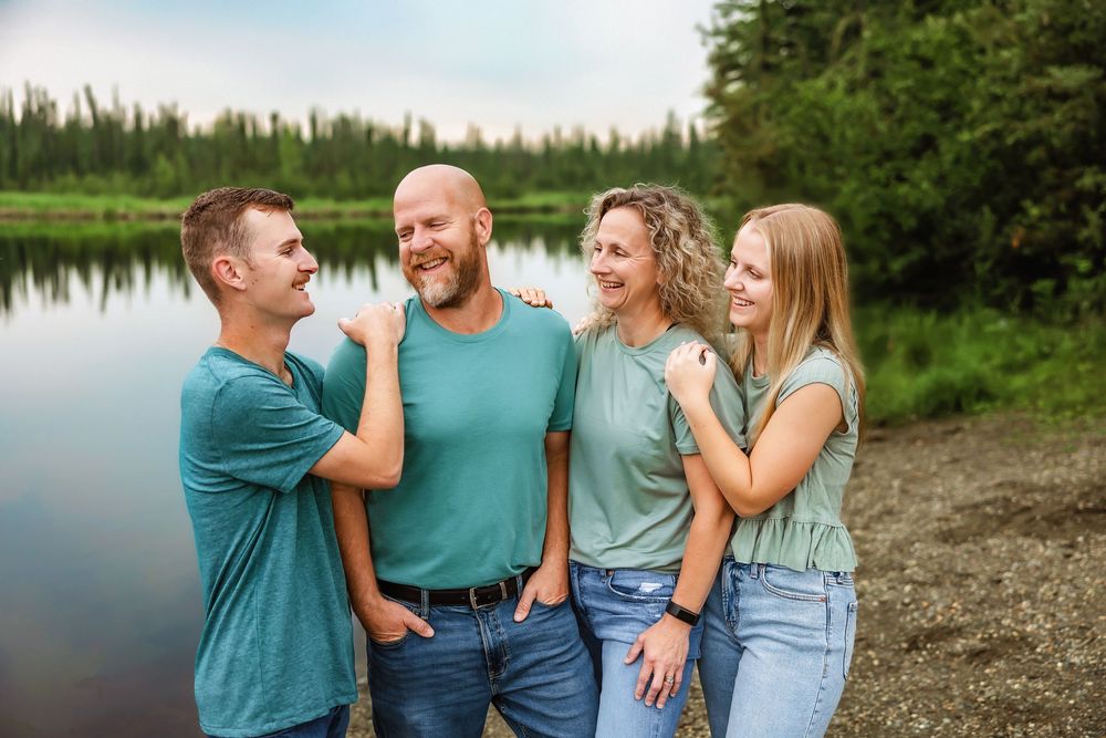 Candid moment of a family happy together during a relaxed generational portrait session, Fairbanks Alaska portrait photographer