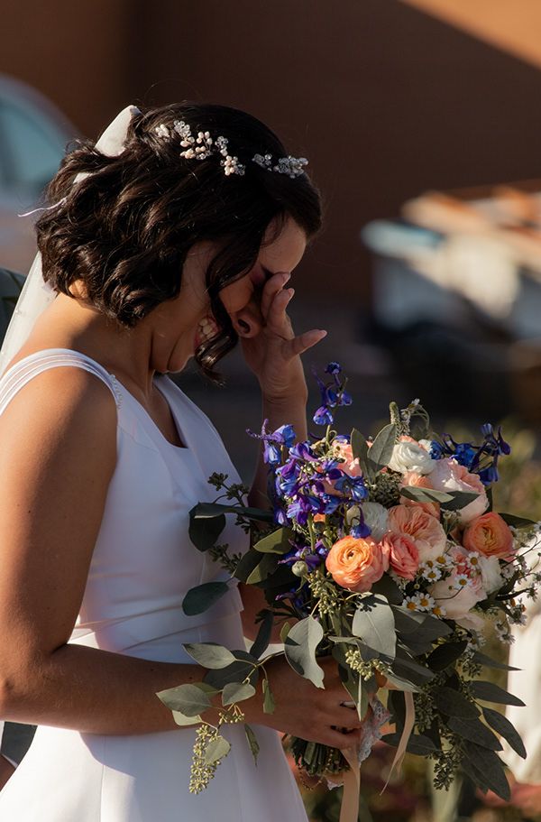 Emotional moment of the bride wiping a tear during her ceremony in Tri-Cities Washington