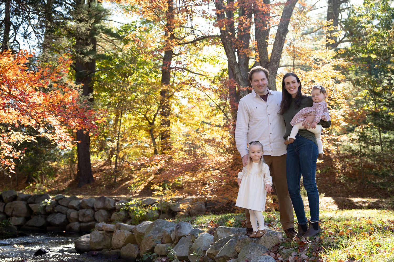 Fall foliage family portraits at the Wayside Inn Grist Mill in Sudbury, MA with Leah Ramuglia Photography.