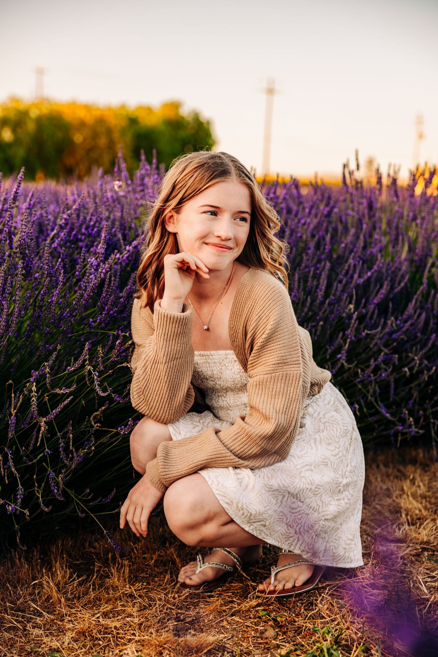 Artistic portrait series in a lavender field featuring warm autumn tones and casual styling.