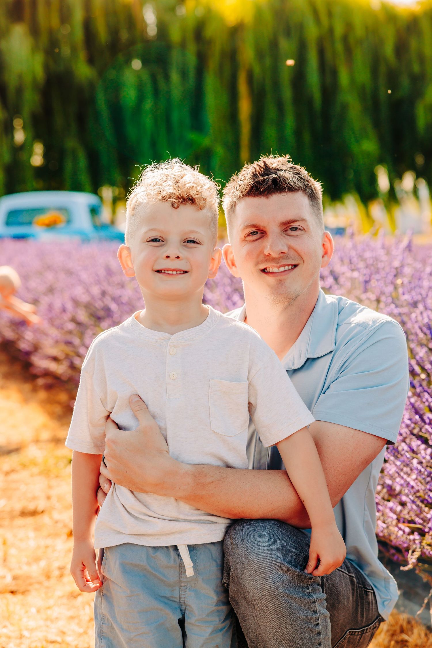 A heartwarming family photoshoot in a blooming lavender field during golden hour sunset.