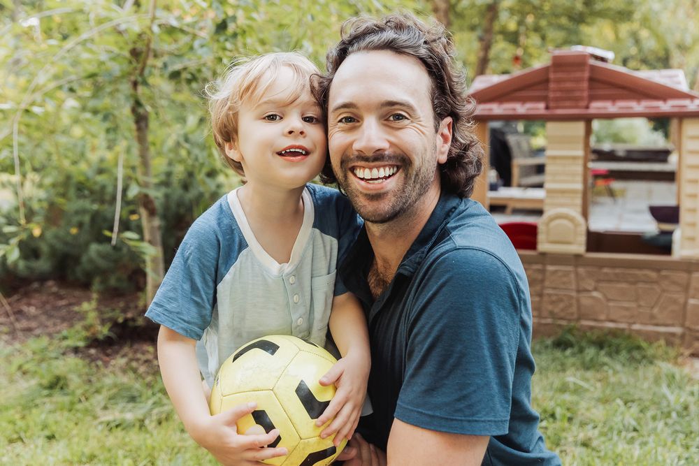 A series of candid family photos showing playful interactions with a yellow ball in a backyard setting.