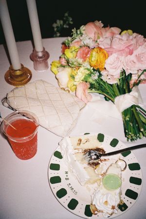 Wedding reception table setting with pink flowers and cocktails.