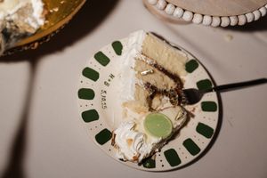 Close-up of partially eaten wedding cake slices on decorative plates.