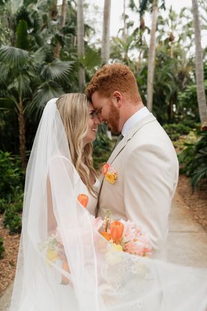 A romantic wedding portrait sequence showing tender moments between newlyweds in a palm garden.