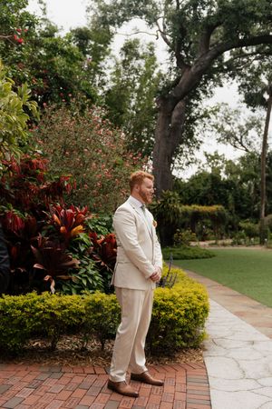 Garden wedding venue with stone pathway and lush tropical landscaping.