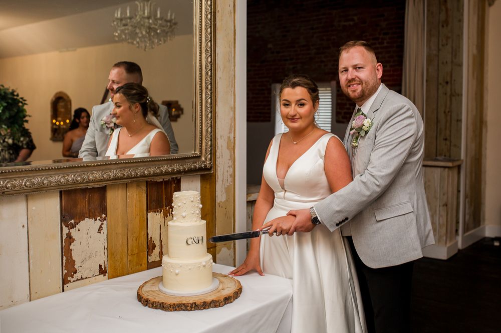 Wedding reception venue with rustic wood accents and elegant decor.