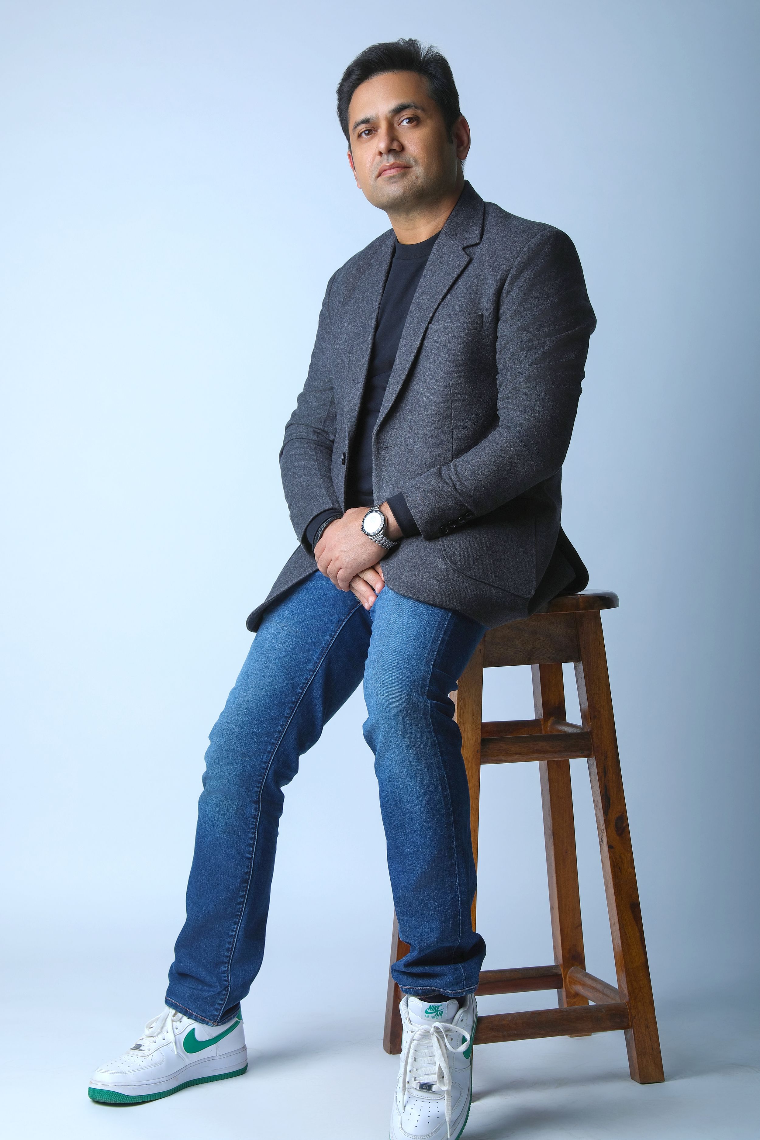 Creative fashion photography shoot in Delhi studio featuring formal menswear styling