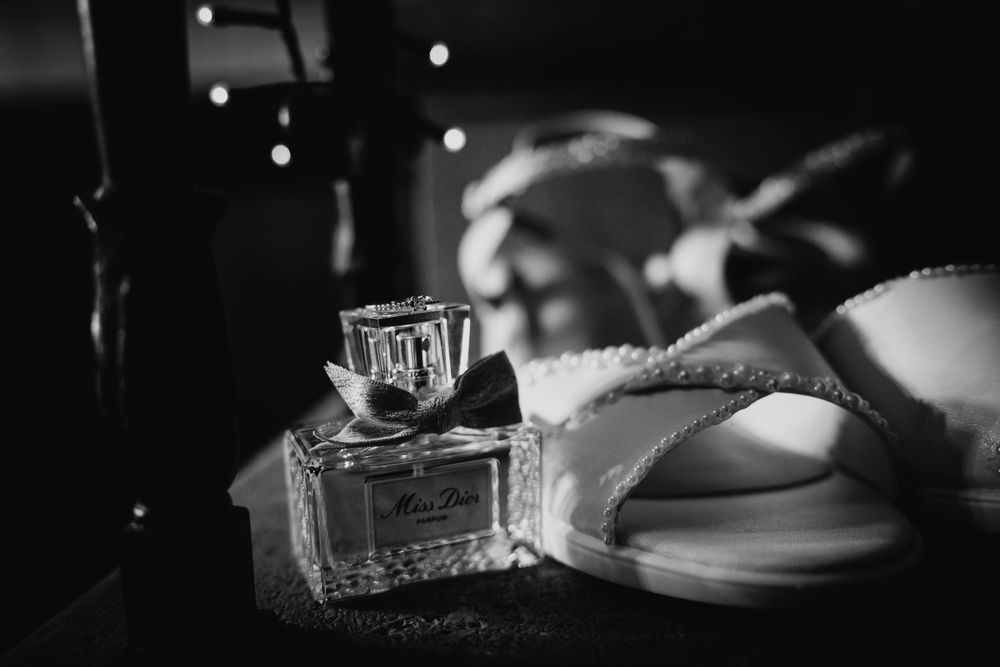 A dark black and white image with soft bokeh lights creating a moody atmospheric effect.