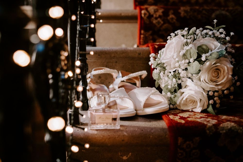 Elegant wedding reception table details with soft lighting and floral centerpieces.