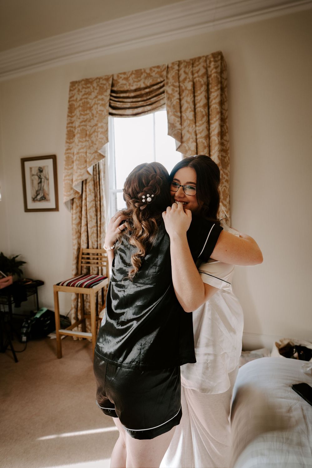 Emotional pre-wedding moments captured in a warmly lit room.