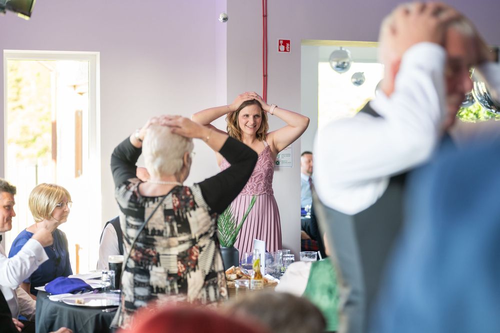 Lively party scene with people dancing and socializing at an event.