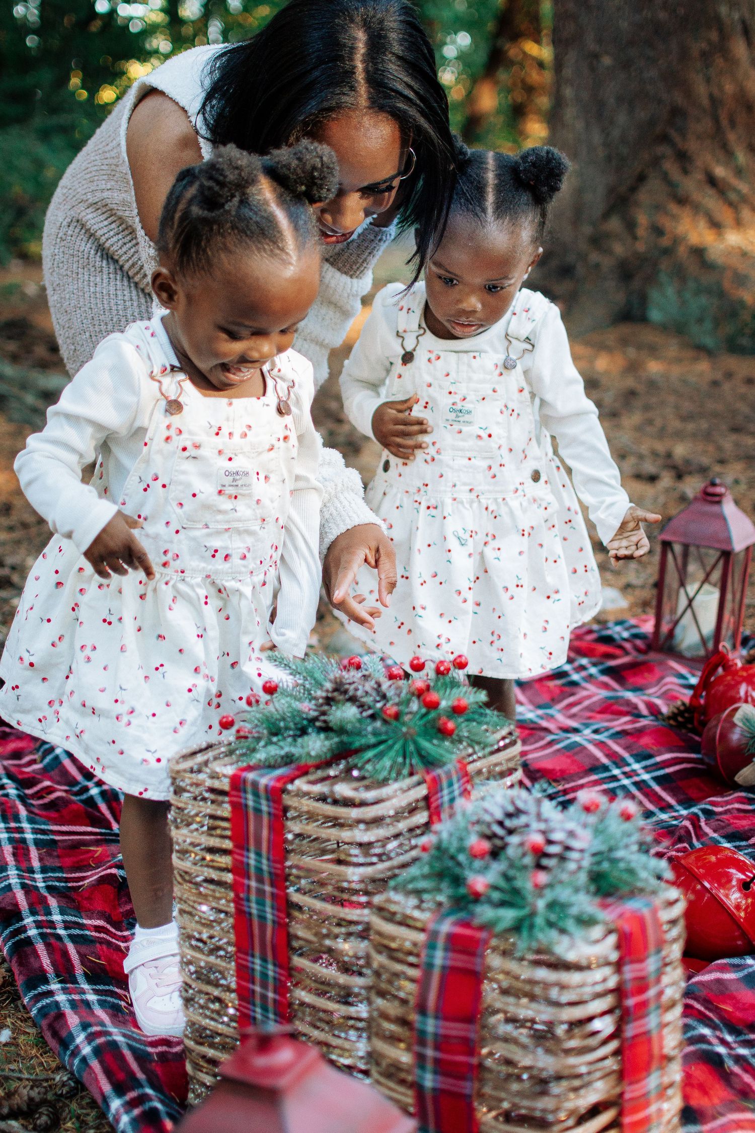 Close-up of children playing near festive red lanterns and holiday decor during a mini photo session in Seattle, Washington.
