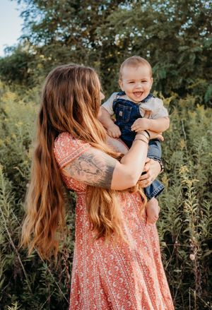 A series of outdoor family photos showing tender moments between parent and child against a natural backdrop.