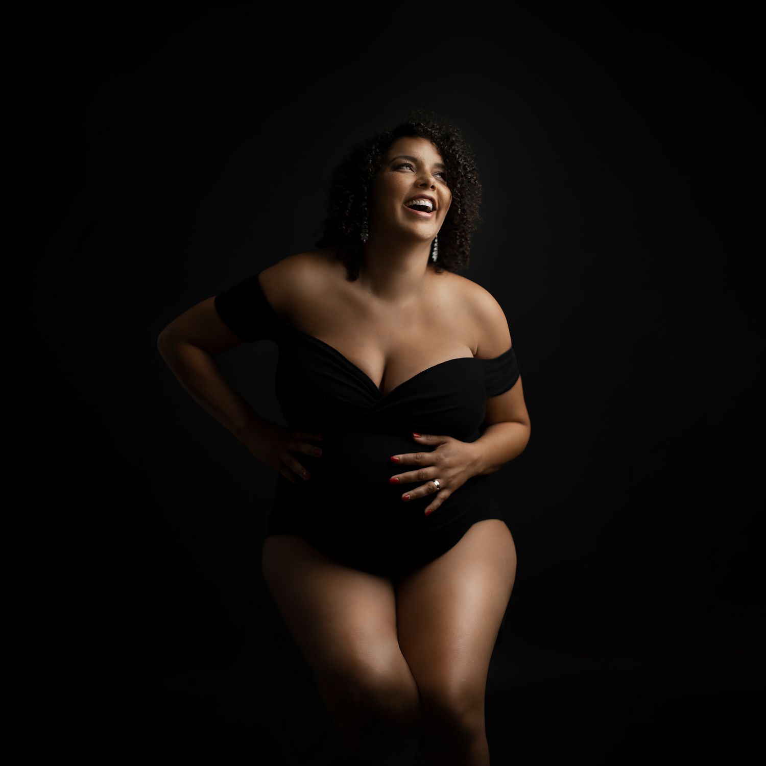 Artistic boudoir photography series in dark moody lighting with black background shows elegant feminine silhouettes.