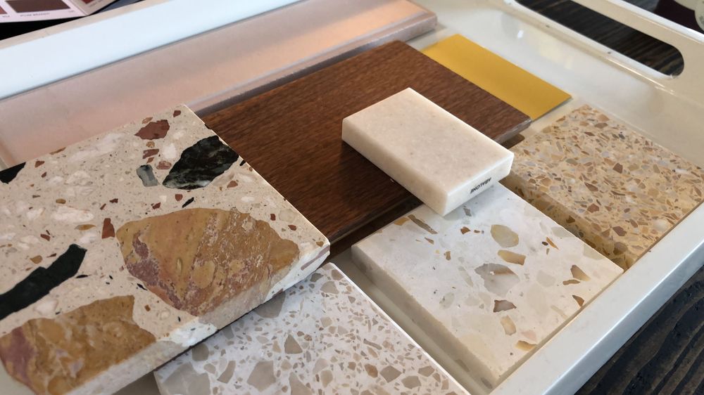 Interior design sample board showing worktops and terrazzo floor. Corian worktop samples