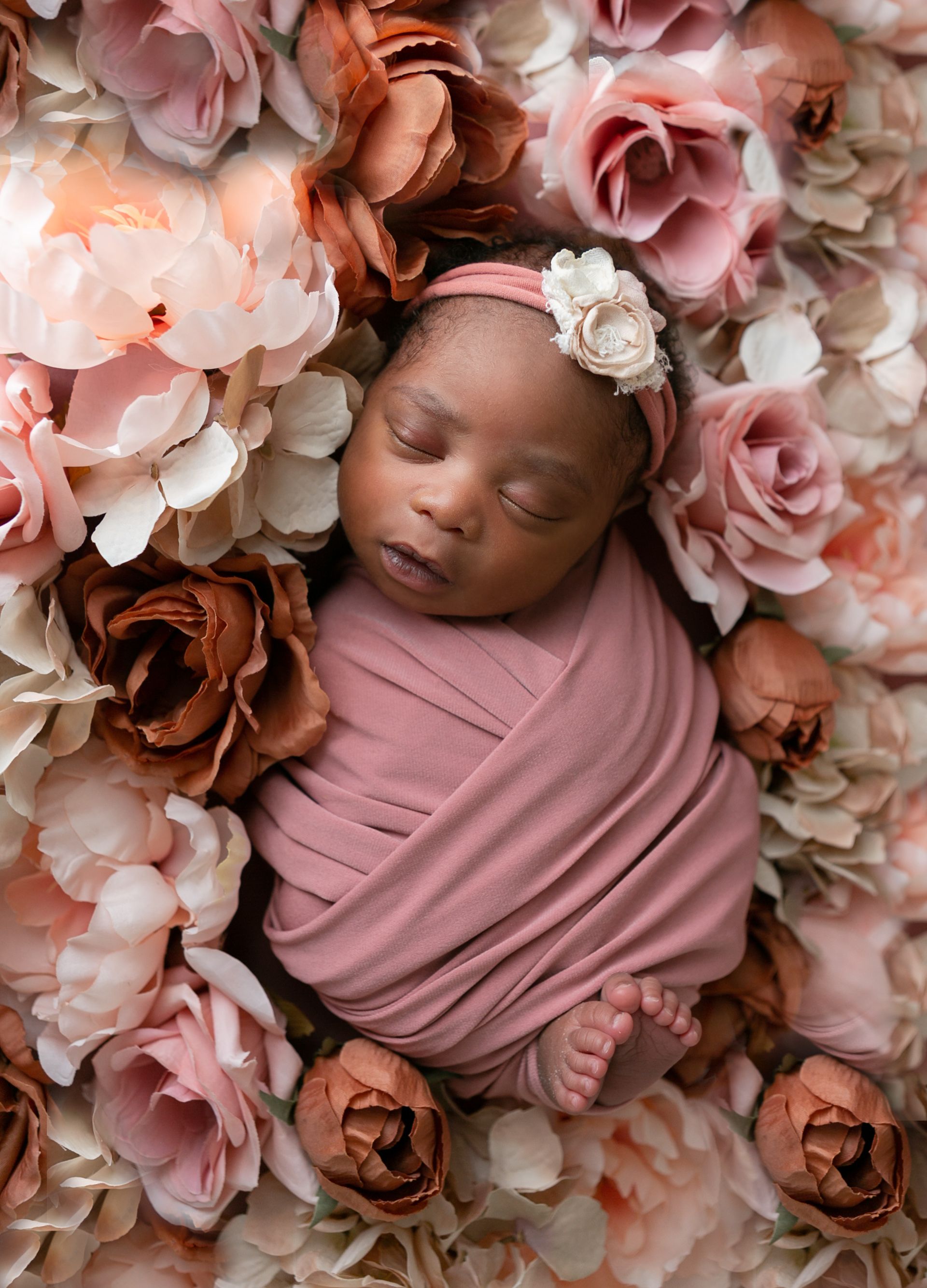 Orlando FL Newborn Photography 21 Moments Photography newborn girl sleeping peacefully on a bed of flowers