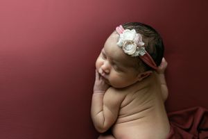 Orlando FL Newborn Photography 21 Moments Photography newborn girl wearing pink and white headband