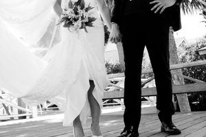 A series of black and white wedding photos showing couples dancing at a reception.