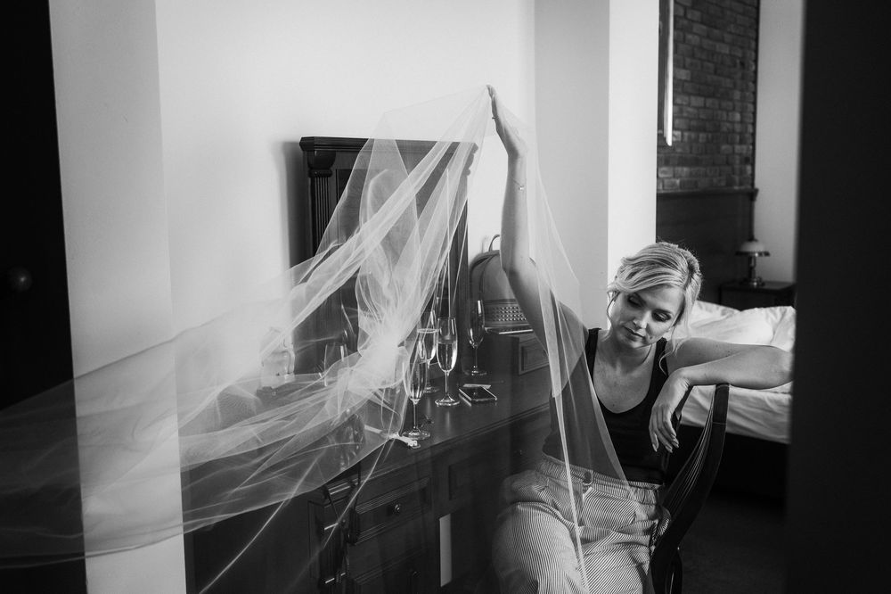 Documentary style sequence showing movement in a minimalist white interior space.