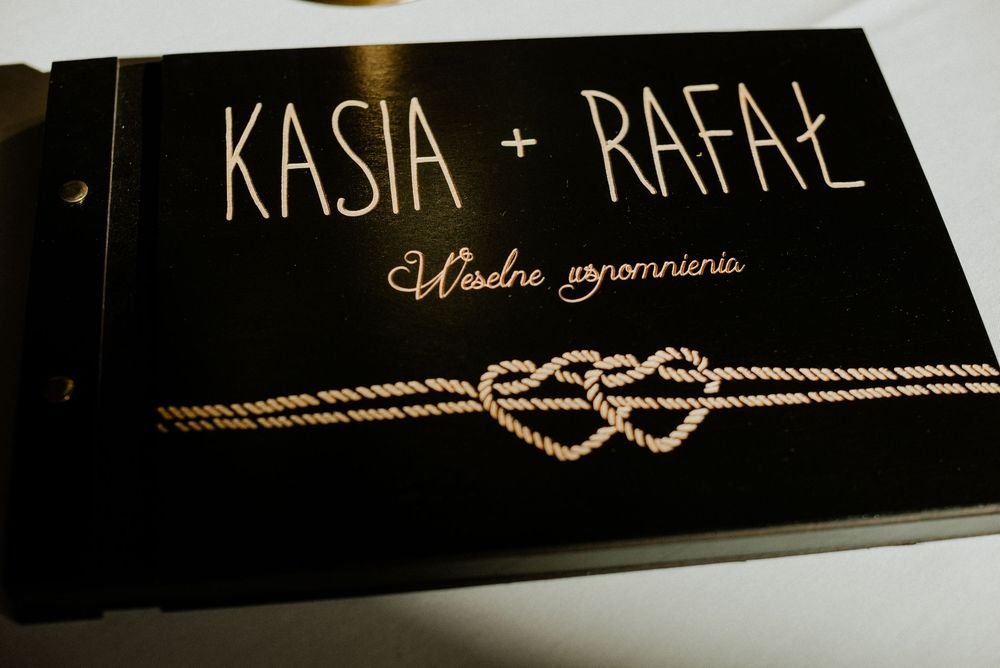 Wedding album cover with rope heart design and couple's names Kasia and Rafal.