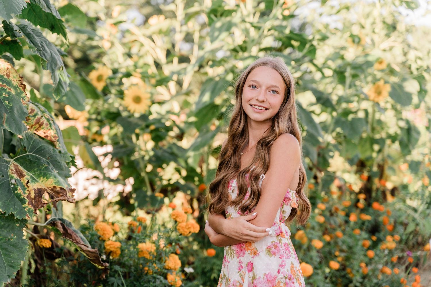 Senior portrait photographs taken with yellow sunflowers at GardenView Flowers