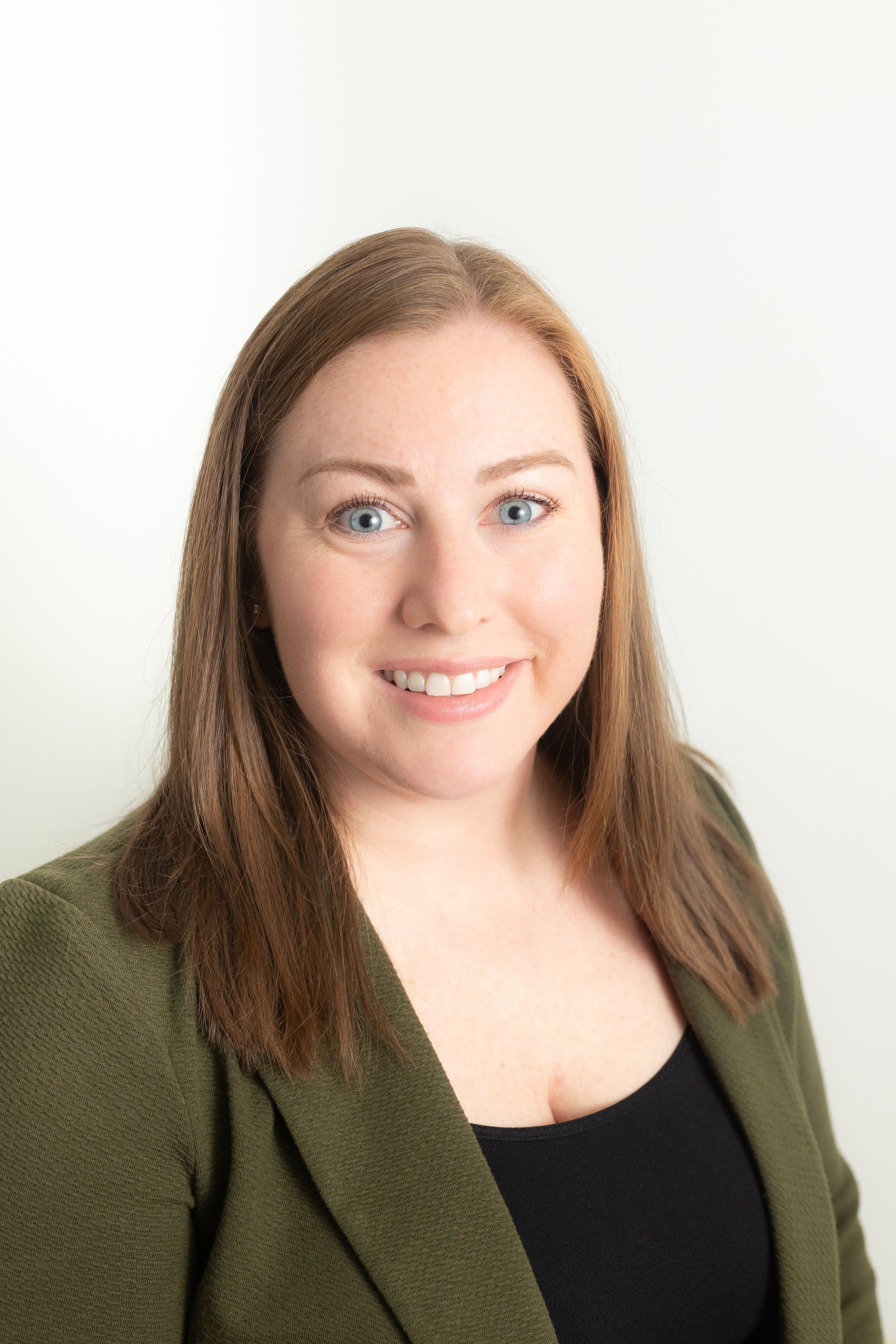 Updated headshot for a Jacksonville NC real estate professional photographed in natural light