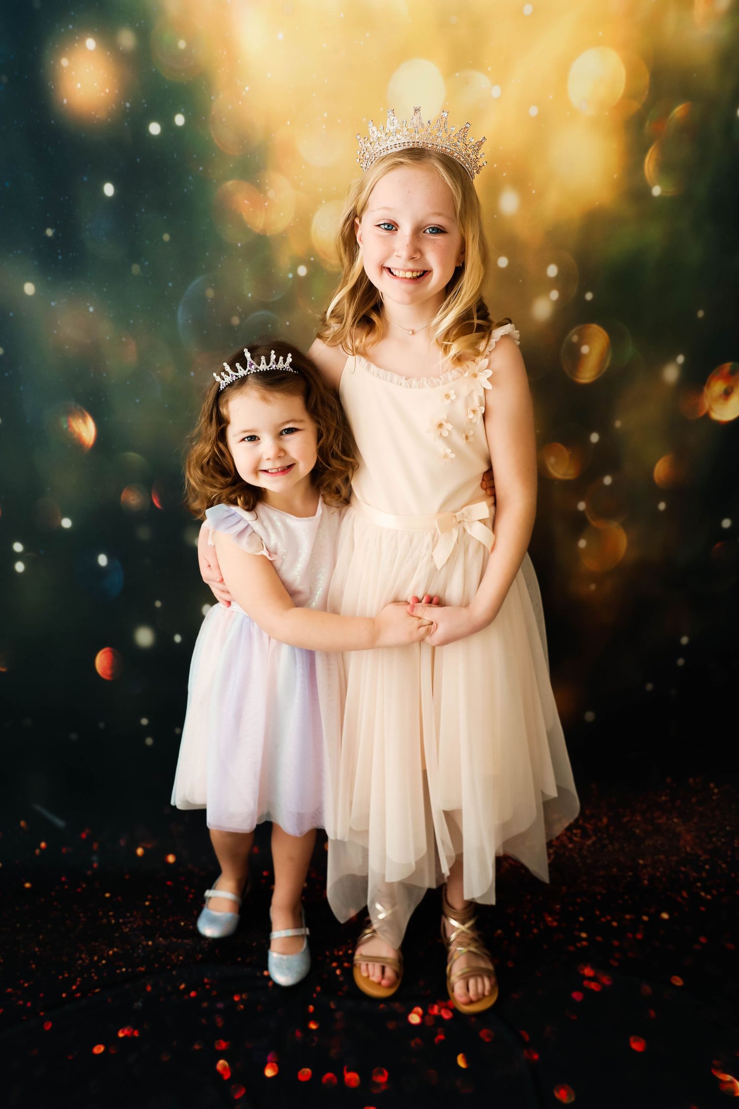 Two small children dressed as fairies with a glitter background looking up at the camera.
Best child photographer, Central Peoria, IL.