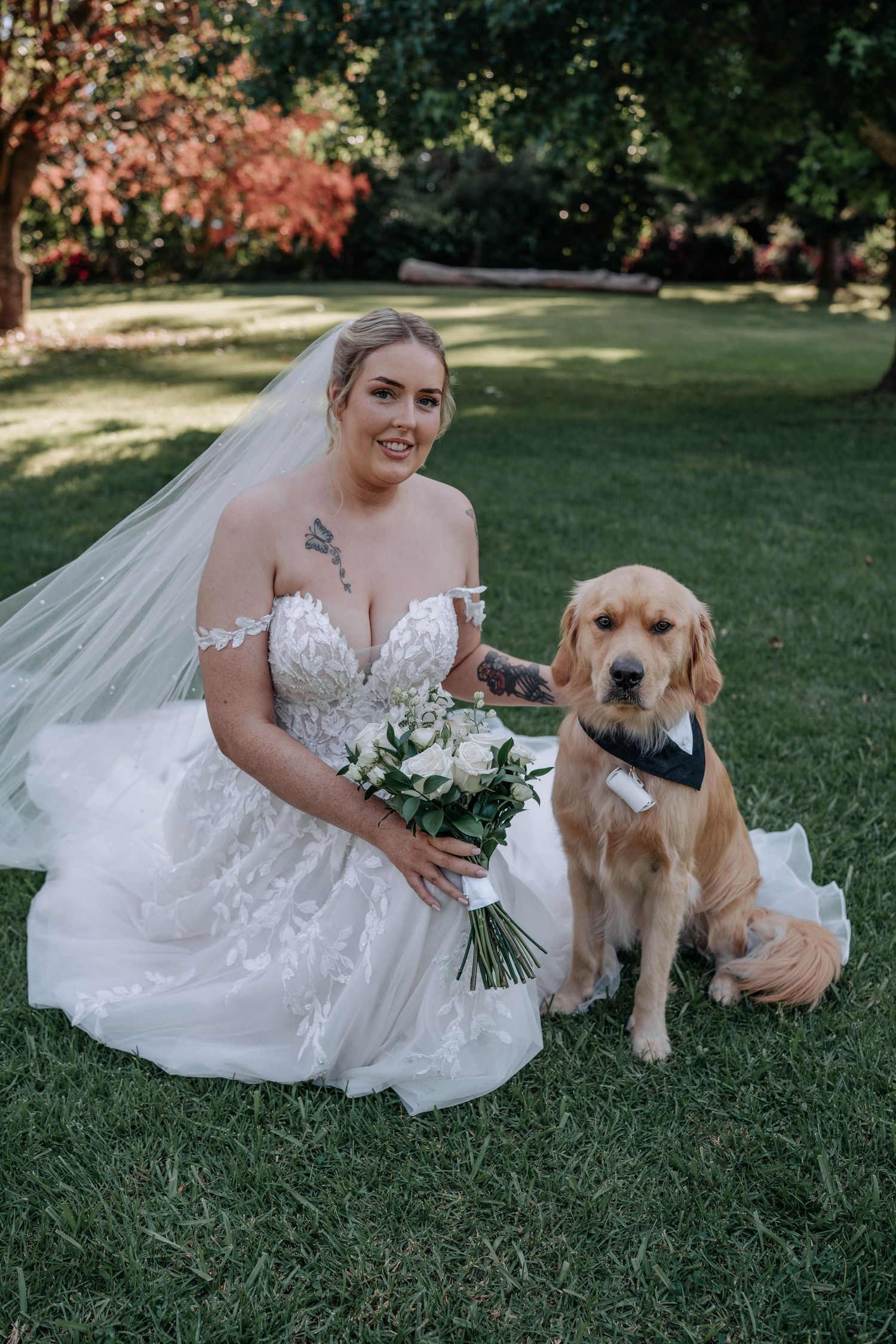 Wedding photos featuring a Golden Retriever posing with someone in a white lace wedding dress on green grass.