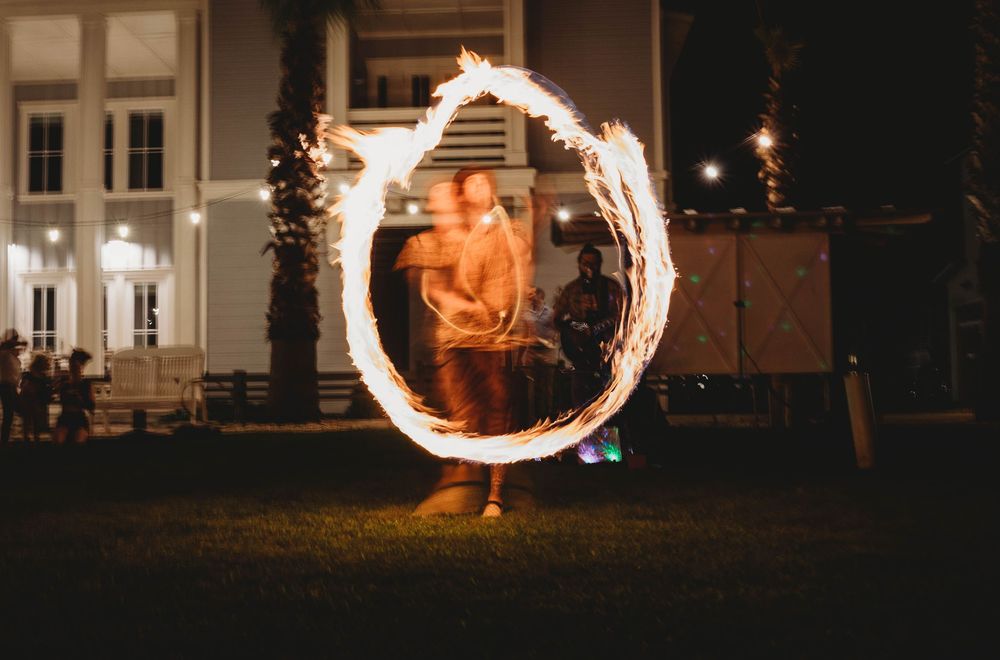Long exposure fire ring during event session.