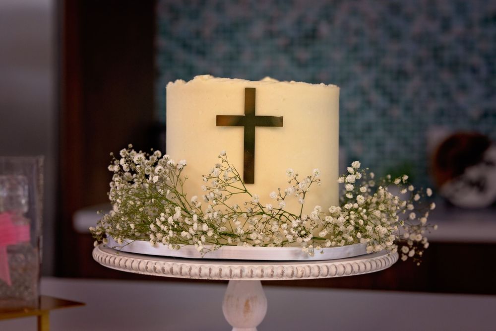 Cake on cake stand surrounded by baby's breath photographed during an event session.