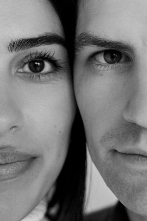 A black and white collage shows close-up shots of smiling expressions and eyes arranged in a horizontal strip.