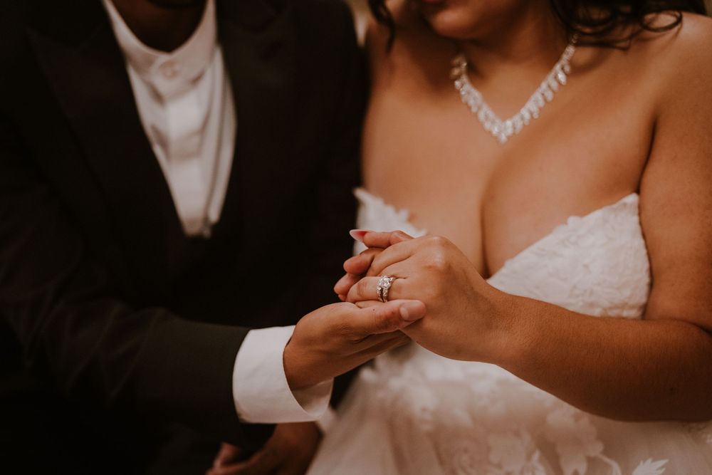 Close-up of bridal jewelry and dress details.