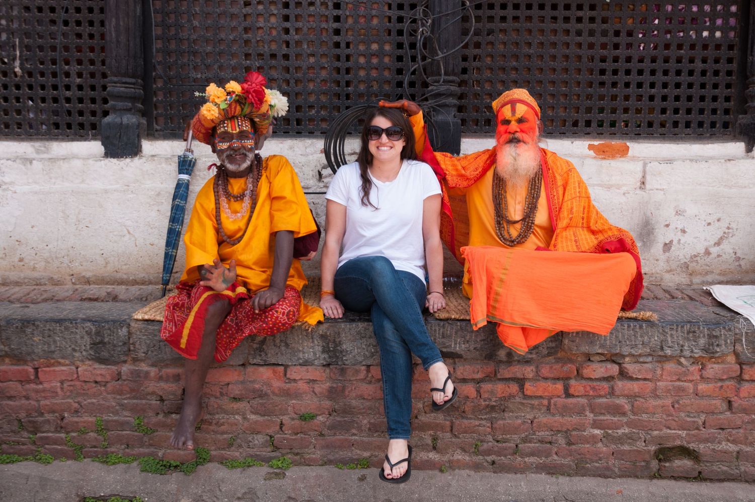 Leah Ramuglia photographed with holy men, sadhu, at Pashupatinath Temple in Kathmandu, Nepal in 2017.