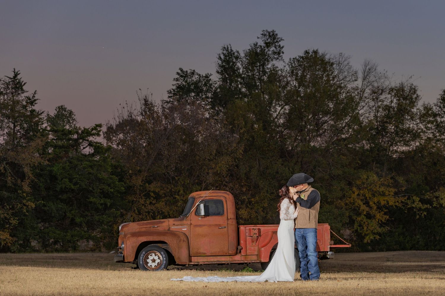 bridal portraits with antique truck at The Diamond Wedding Venue in Cumby, Texas