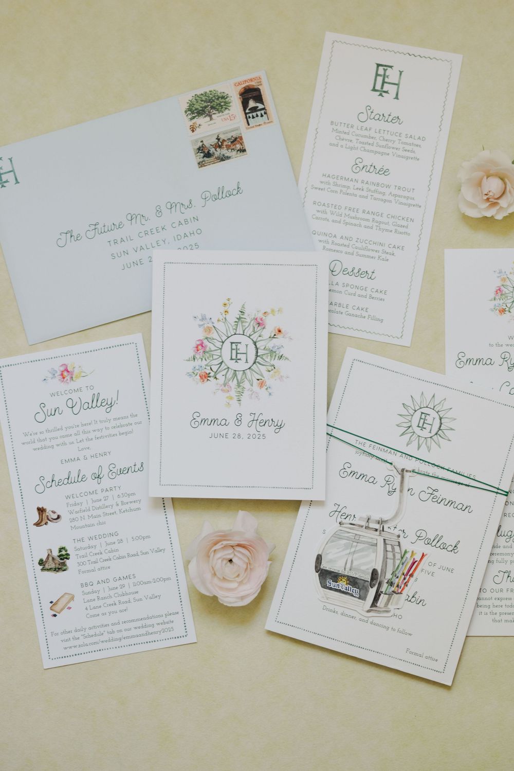 Elegant wedding invitation suite with floral designs, monogram details, and blush pink accents laid out on cream background.