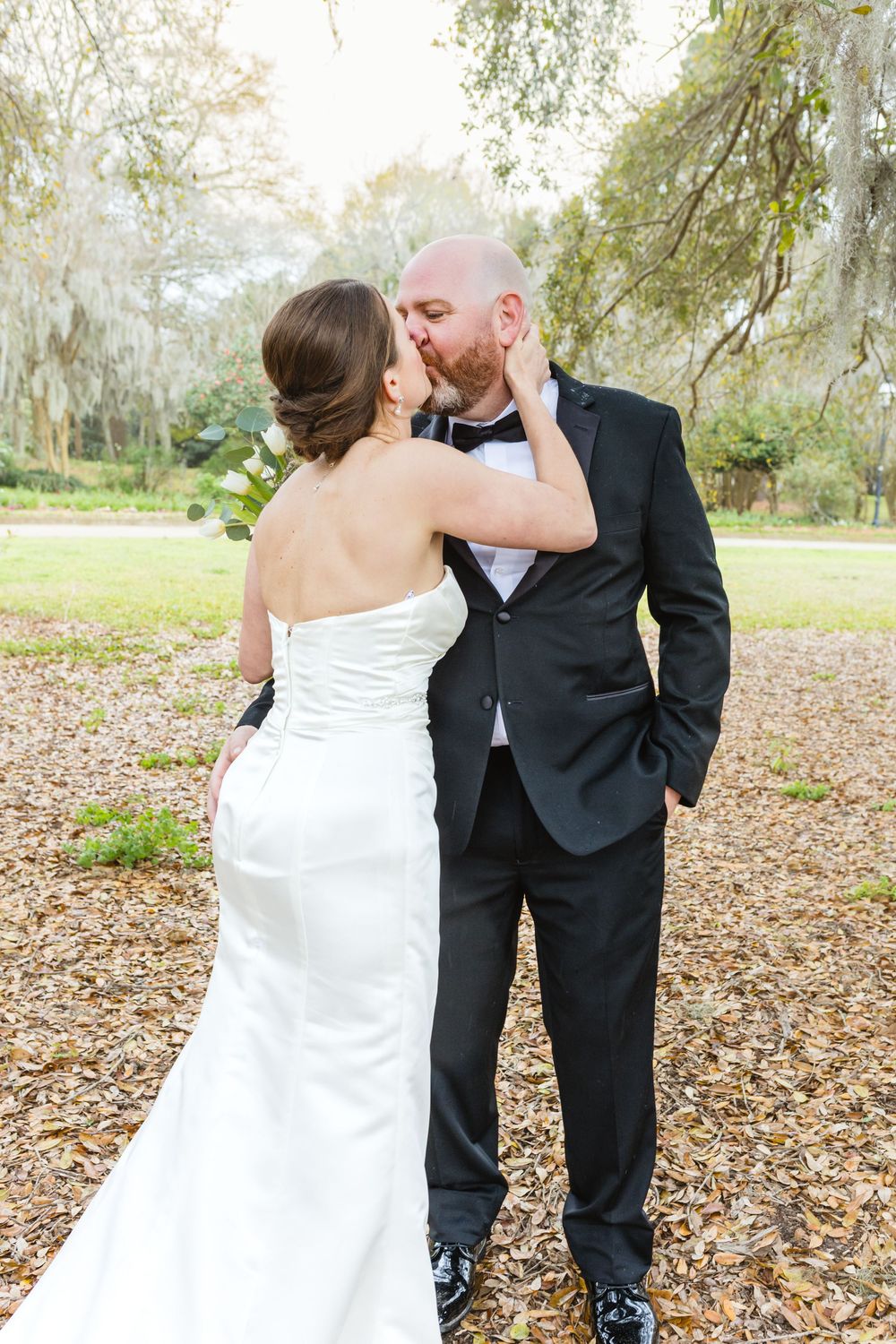 Romantic wedding couple shares intimate moments during their outdoor autumn photoshoot.
