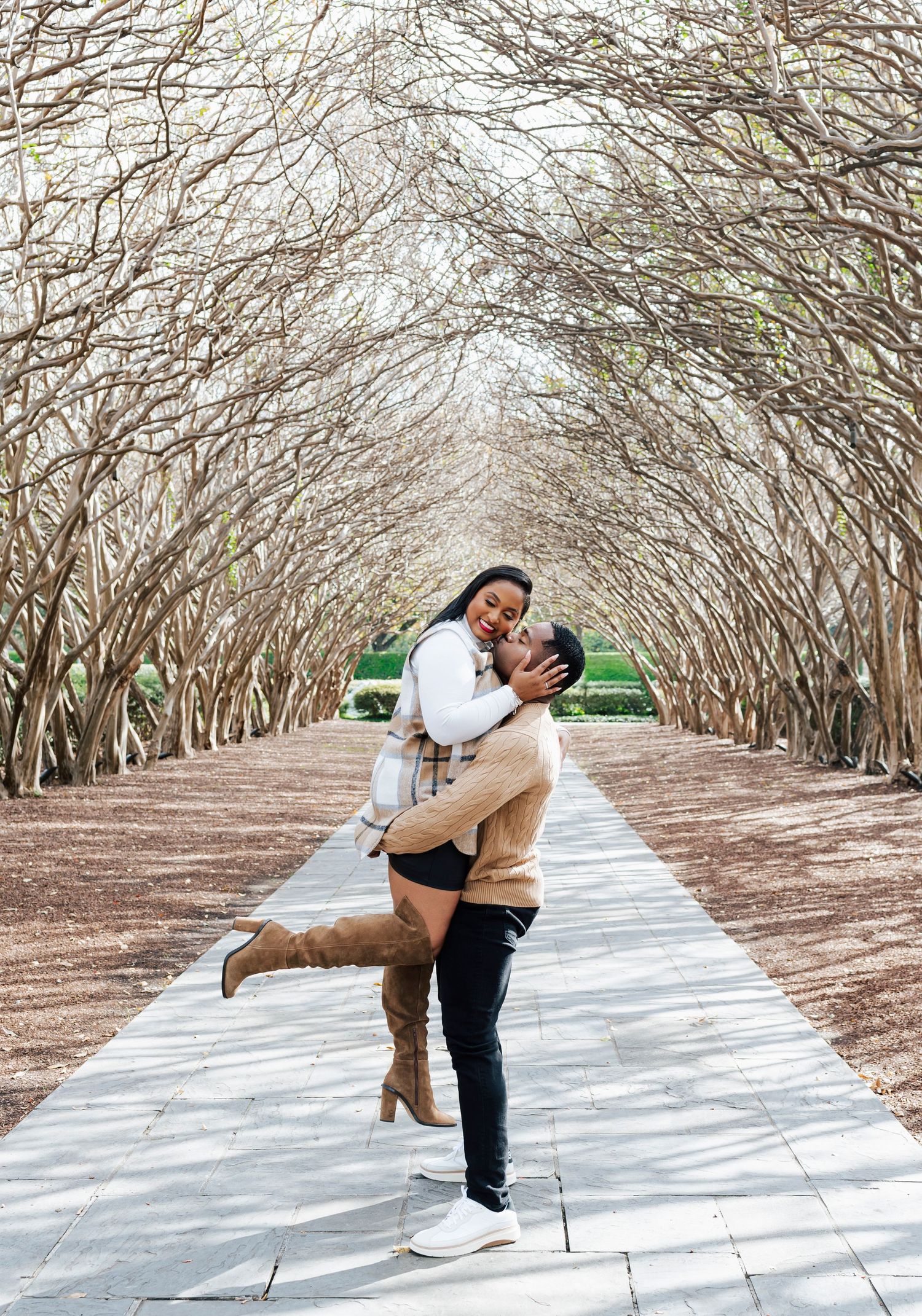 Stylish couple in coordinated outfits at the Dallas Arboretum