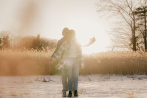 Golden hour winter photography session with backlit snow.