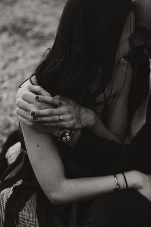 Artistic black and white close-up shots capturing intimate romantic moments between a couple.