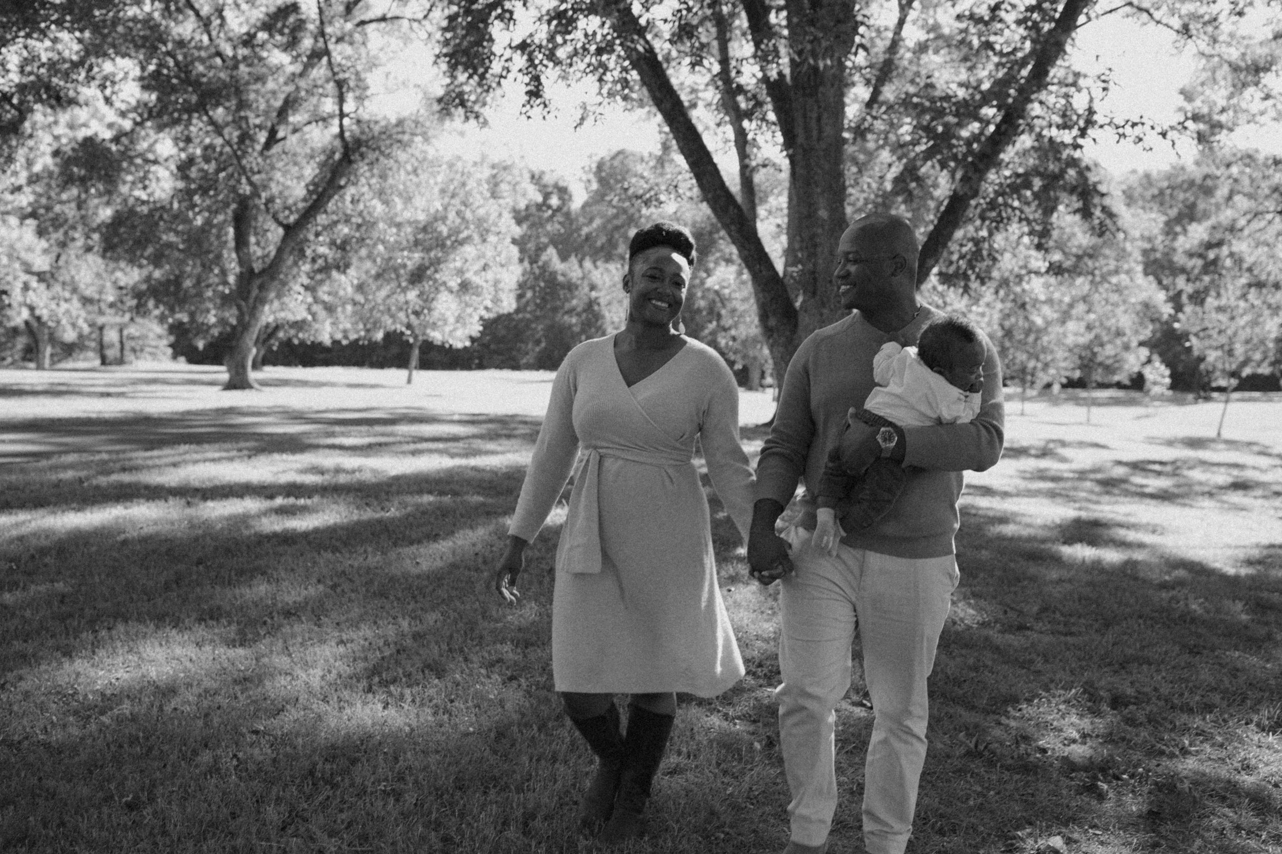 Couple walking together in a park on a sunny afternoon.