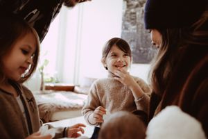 Intimate family moment showing gentle care and bonding with a small baby.