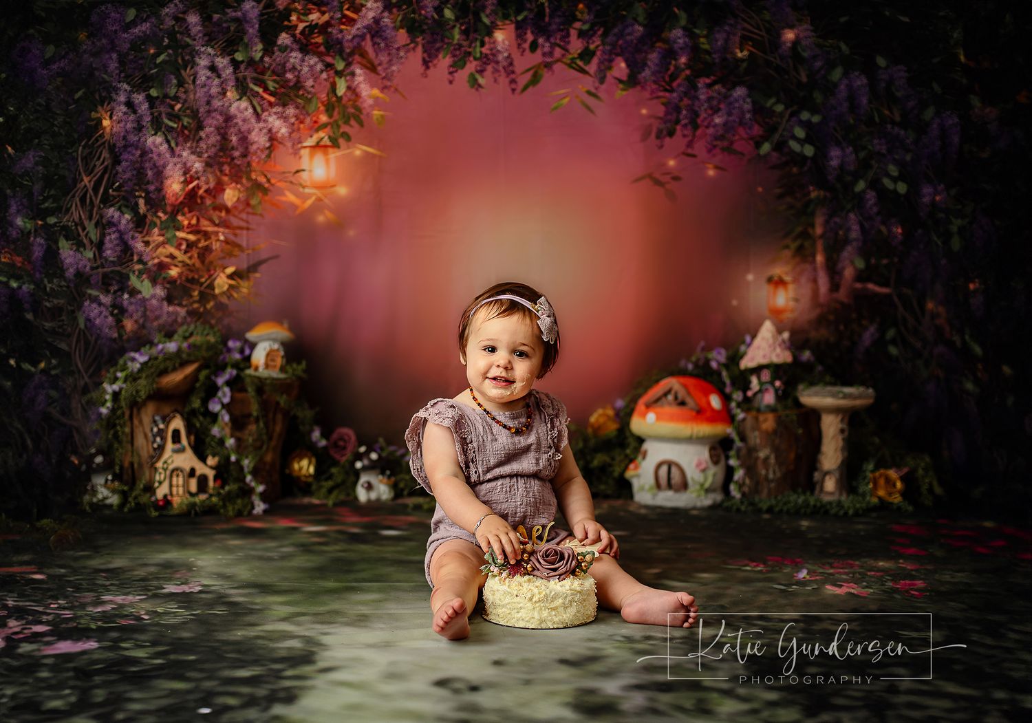 A whimsical fairy garden scene features glowing mushroom houses and magical lighting creating an enchanted forest atmosphere. BOP cakesmash