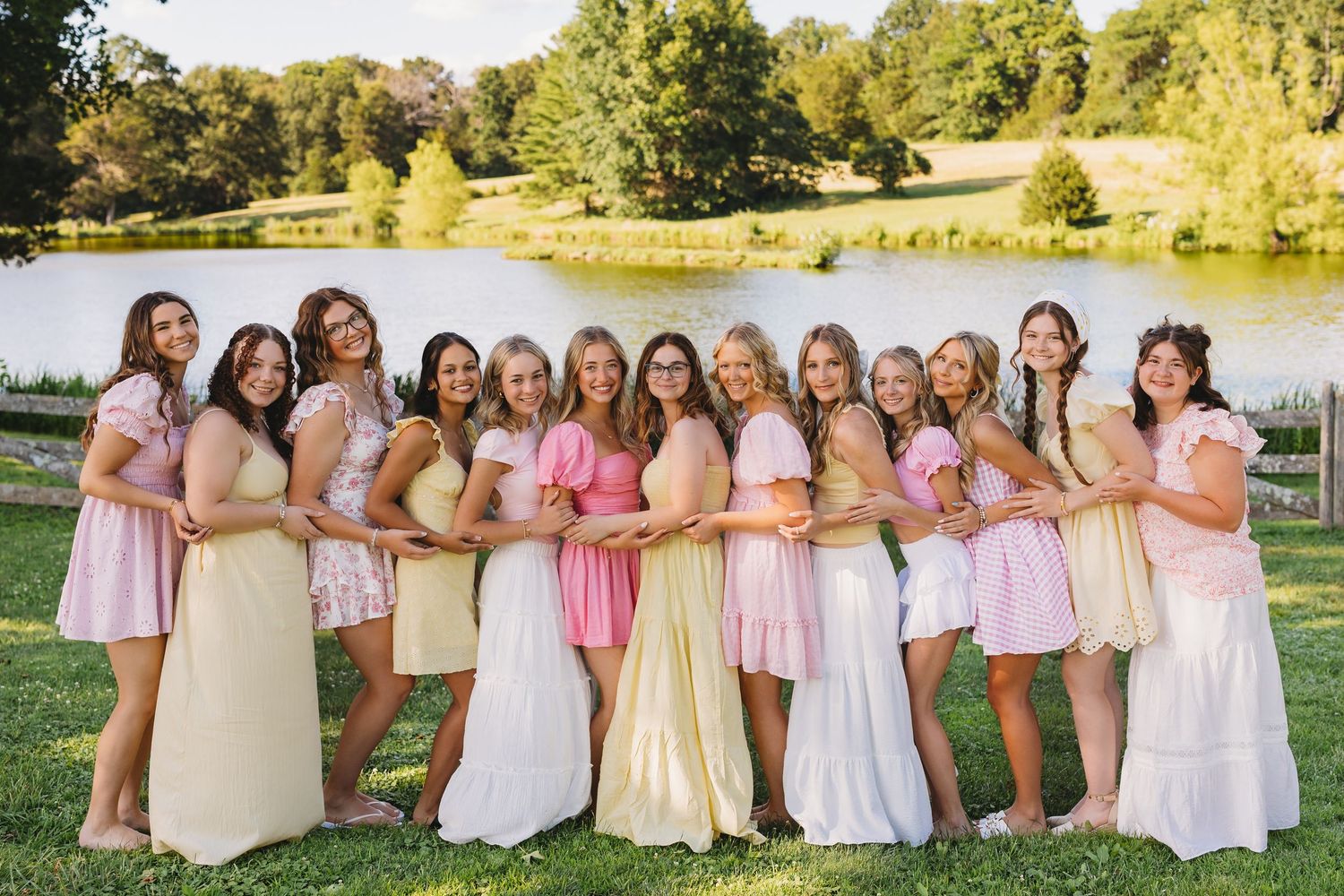 senior girls floral dresses greenhouse behind them
