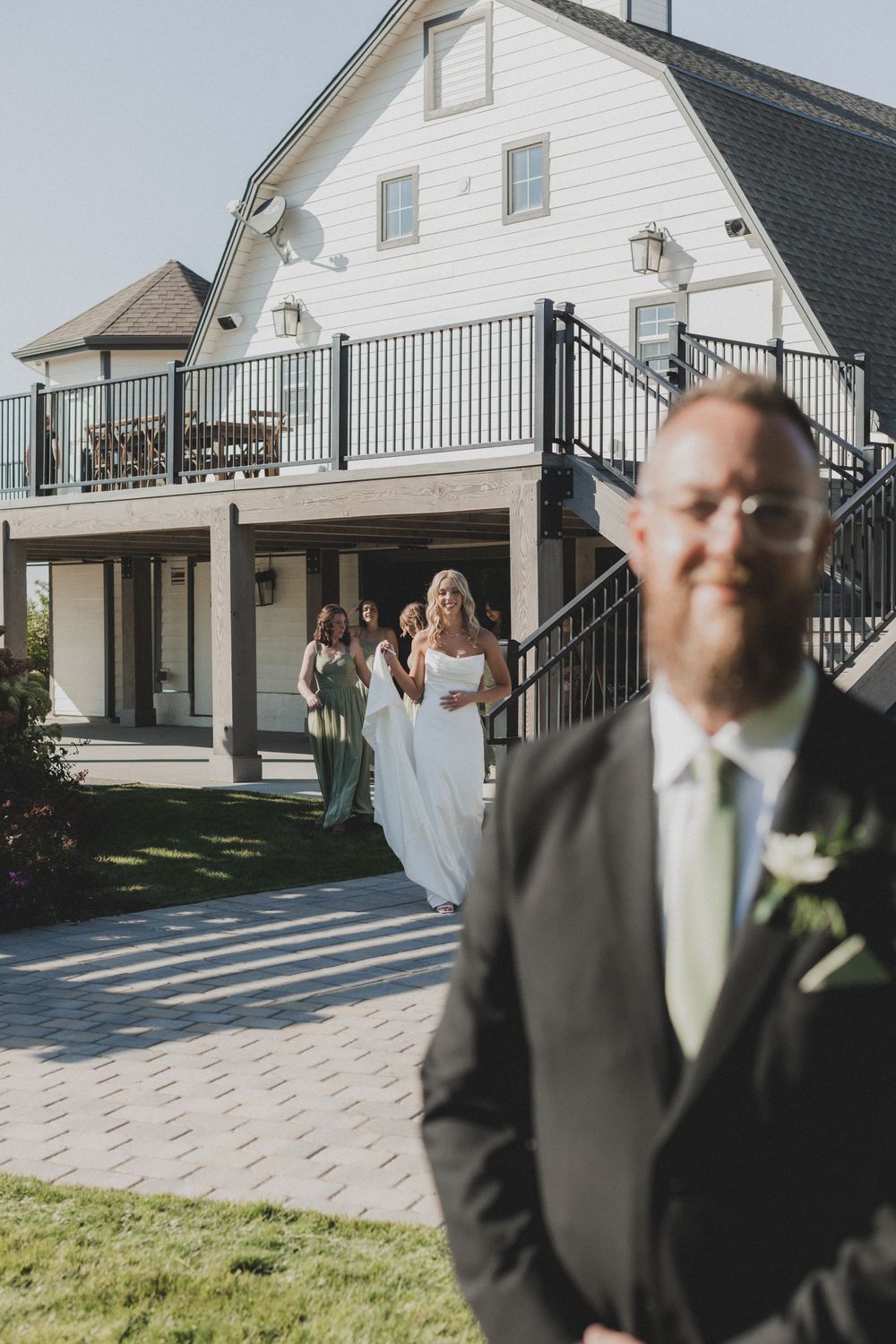 A sequence of wedding photos showing playful moments outside a white building with a balcony.