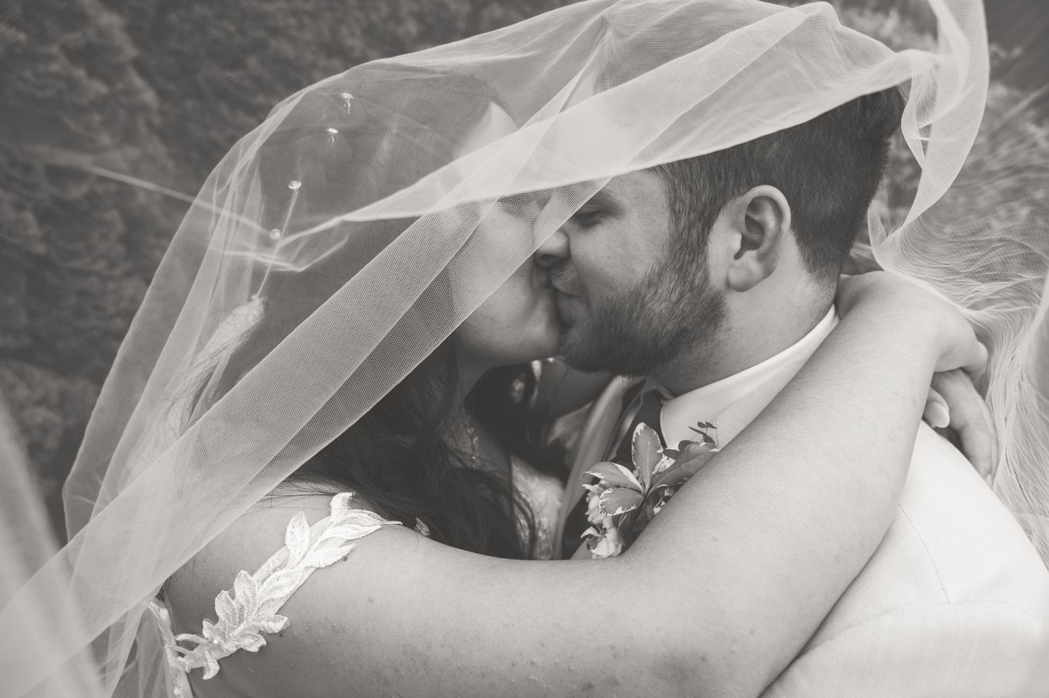 Bride and groom sharing a moment during wedding portrait session, natural, timeless, and romantic.