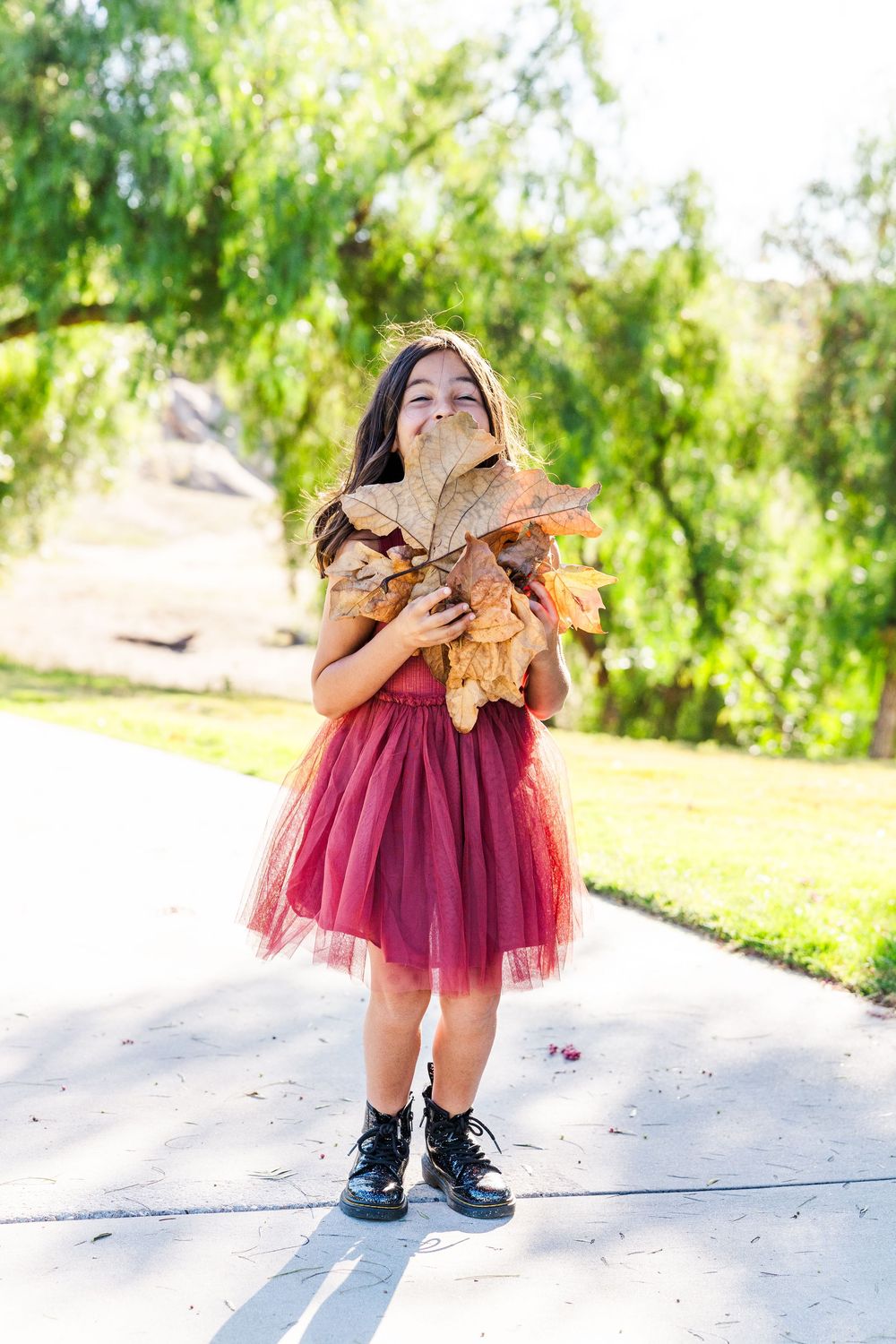 Simi Valley family photography capturing joyful moments with parents, kids, and extended family in beautiful outdoor settings.