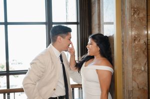 Elopement at the San Diego County Clerks office, couple leaning on wall next to elevator inside the clerk's office after civil ceremony
